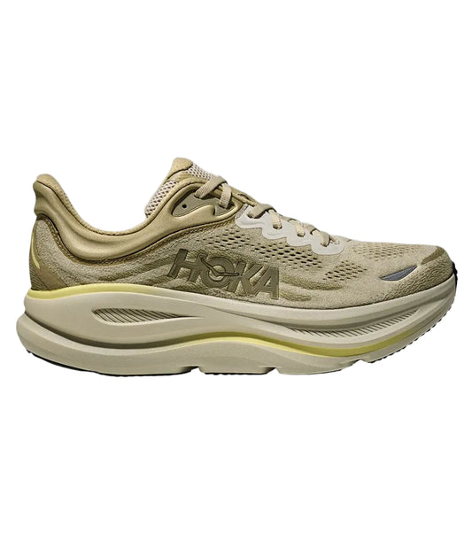 Beige running shoe with Hoka branding on a white background