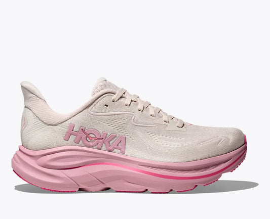 Pink and beige running shoe with Hoka branding on a white background